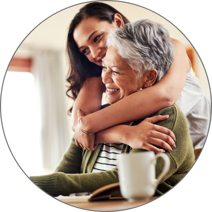 A young woman hugging and older woman